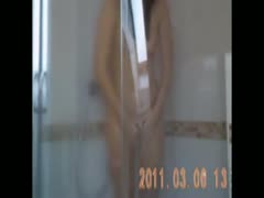 In the shower, my slender girlfriend cleans her beautiful figure.